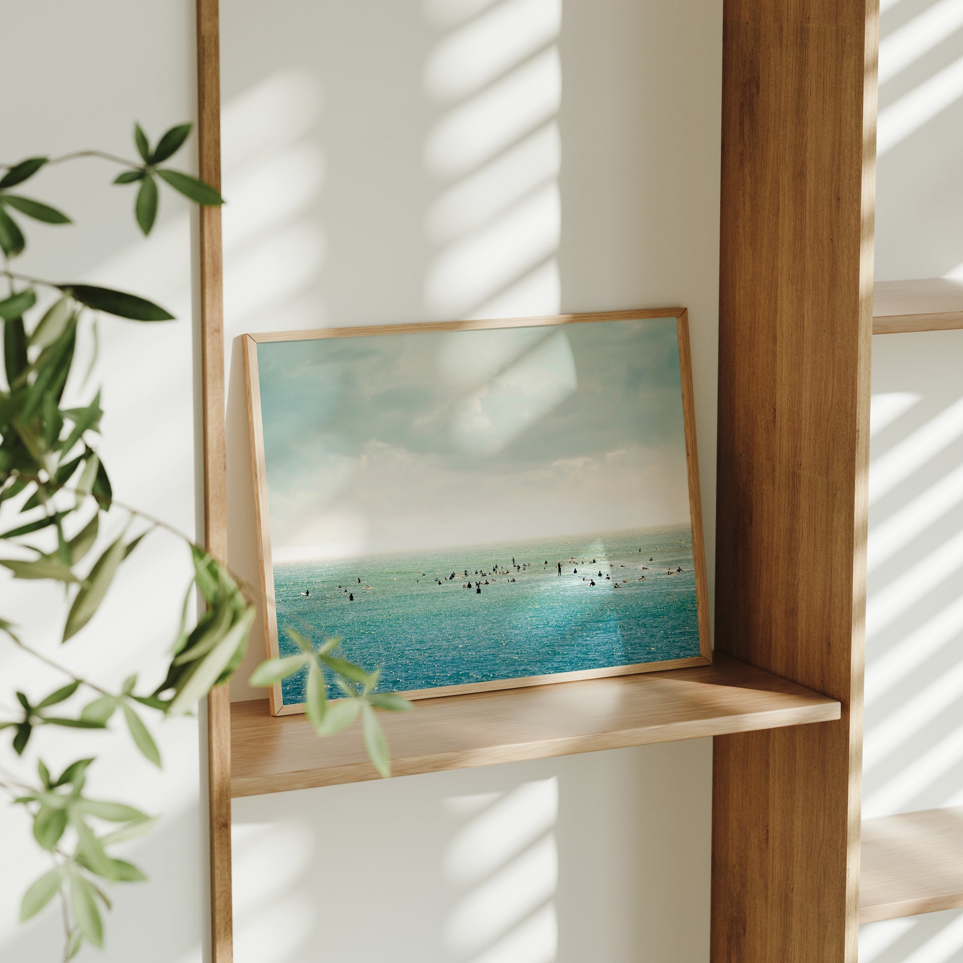 SURFRiDER ocean photo with surfers waiting for waves under moody skies, perfect for coastal and surf-themed decor.