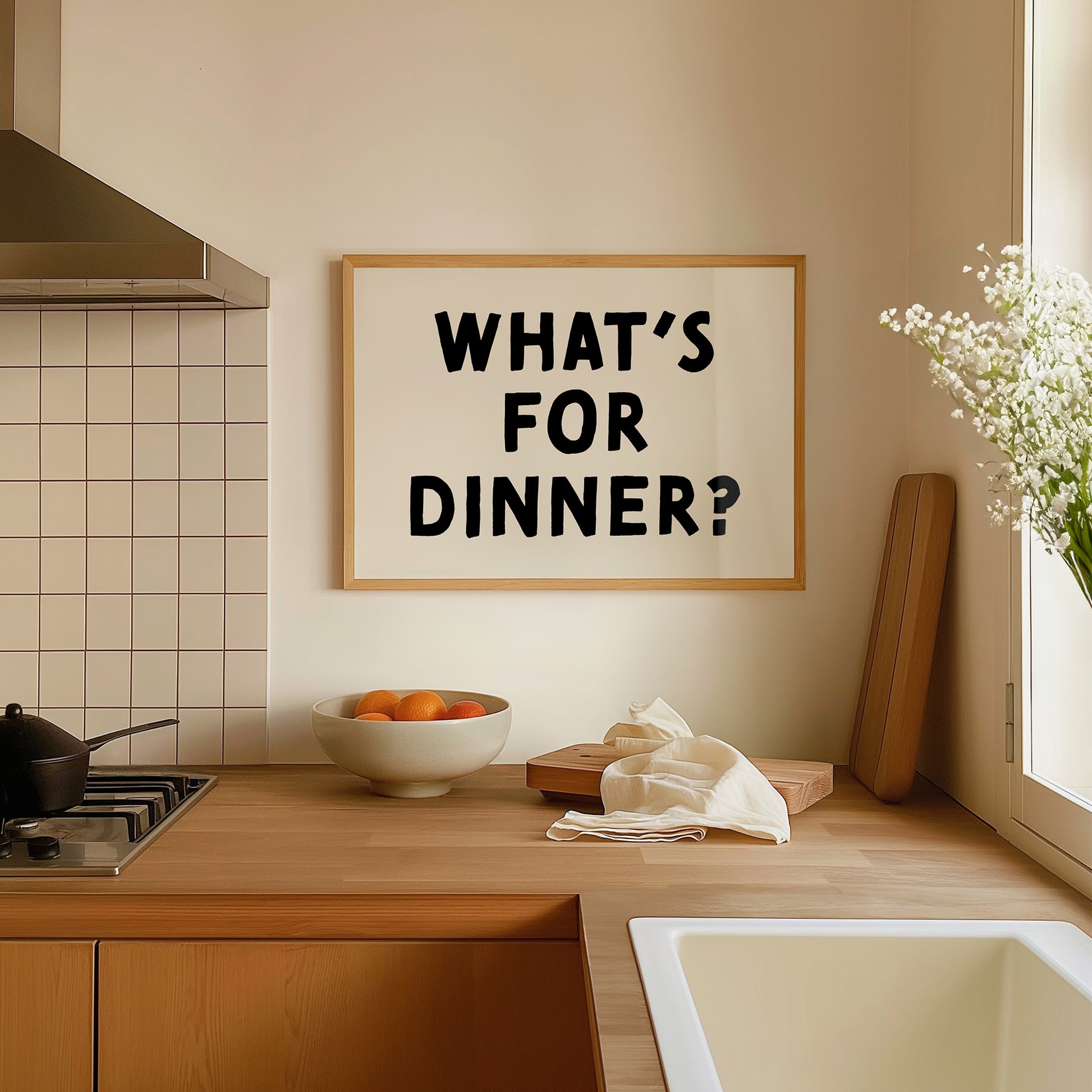 Minimalist kitchen wall art poster reading "WHAT'S FOR DINNER?" in bold black text on white background.