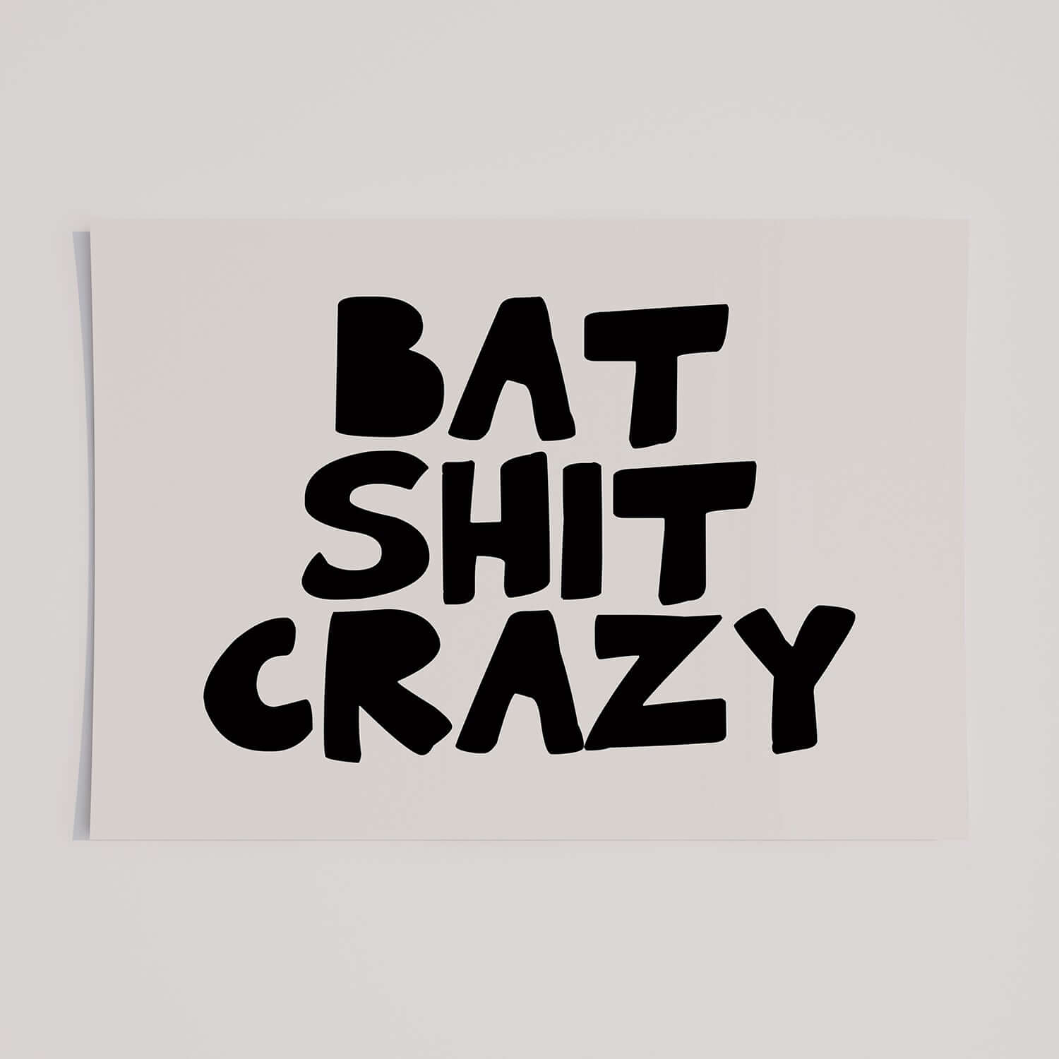 BAT SHiT CRAZY poster with bold black hand-lettered typography on white matte paper, perfect for edgy decor.