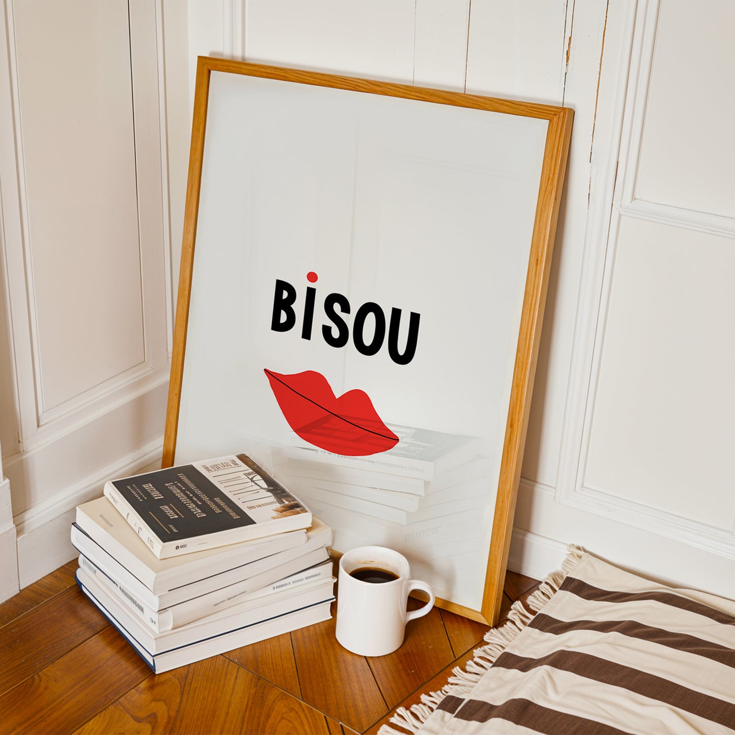 BiSOU poster with minimalist French typography and playful red lips illustration resting by books and a coffee cup.