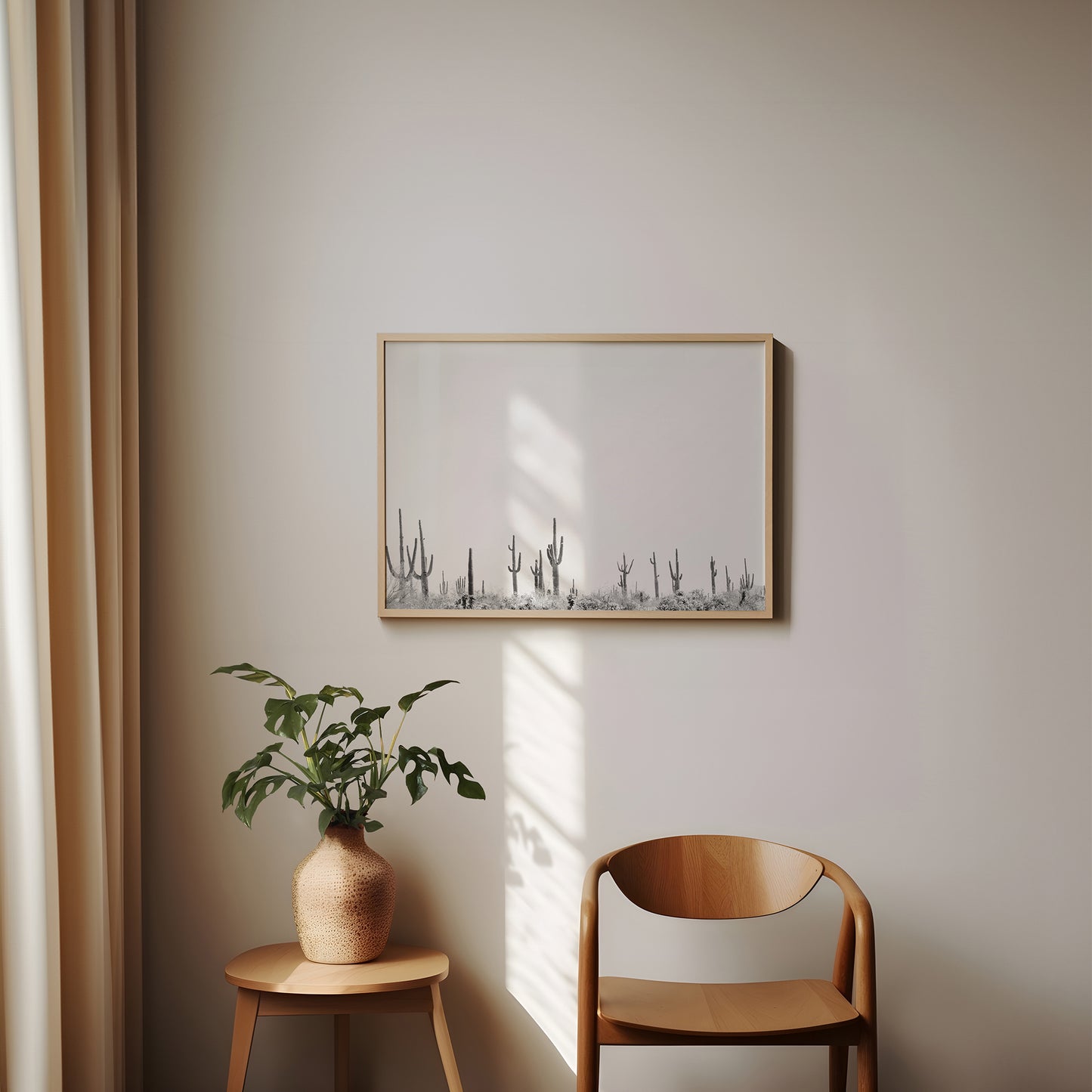 CARNEGiE GiGANTE black and white cactus landscape print displayed in a minimalist modern interior setting.