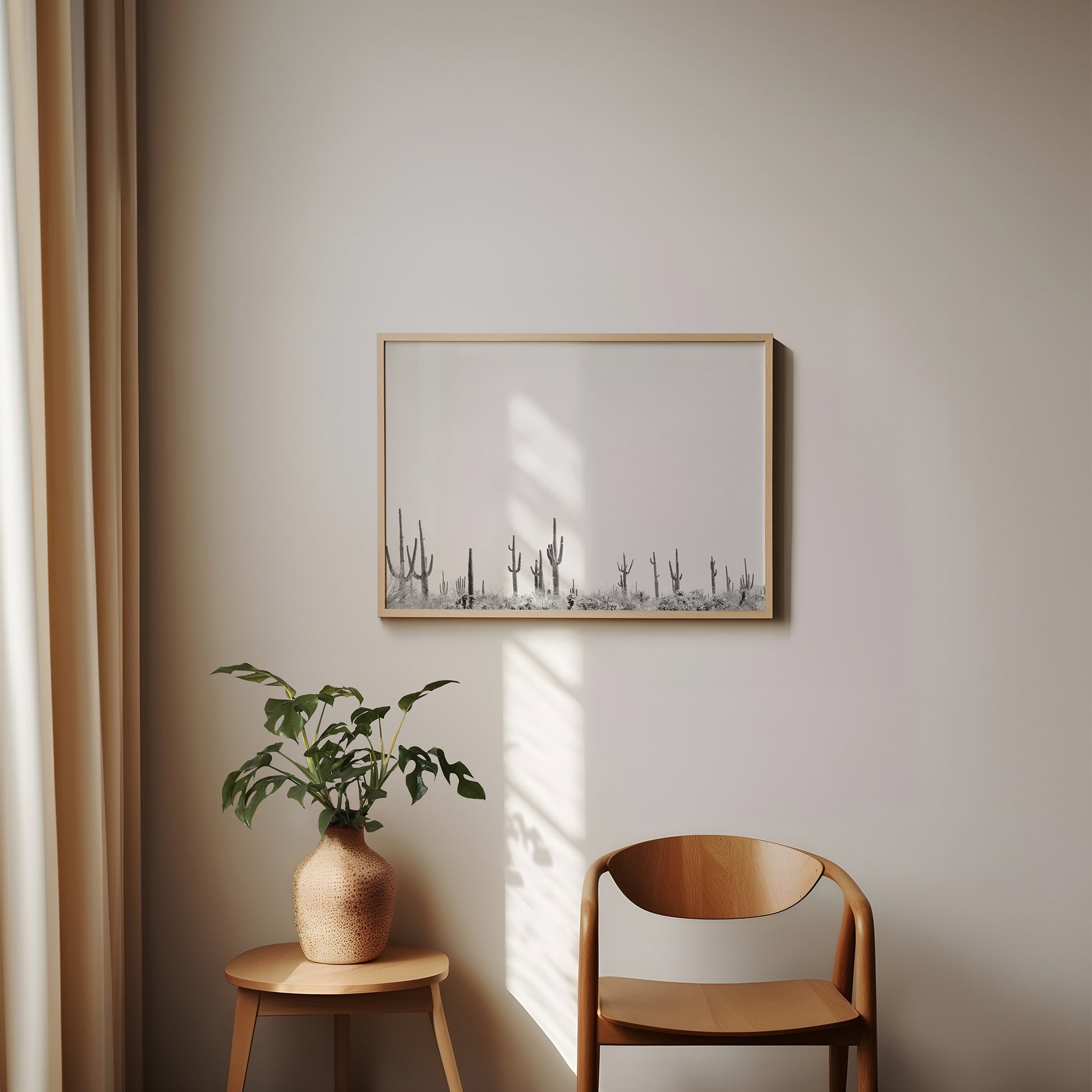 CARNEGiE GiGANTE black and white cactus landscape print displayed in a minimalist modern interior setting.