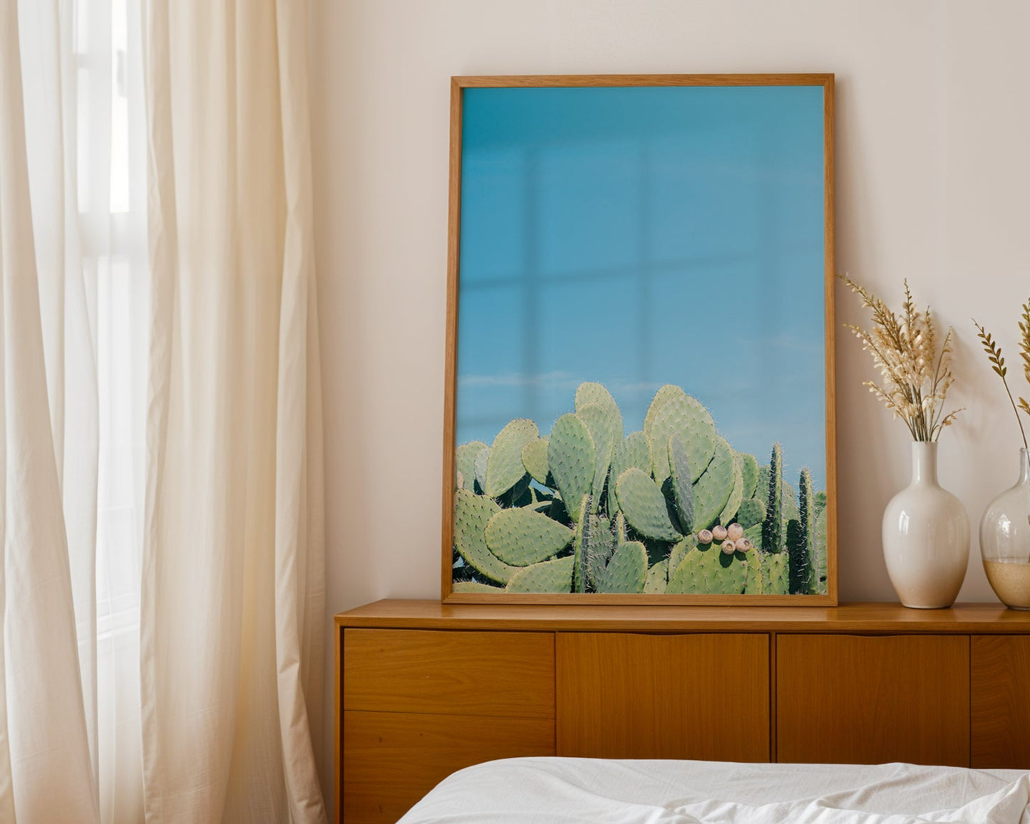 DAYDREAM artwork featuring prickly pear cacti under a clear blue sky in a modern Southwest minimalist interior.