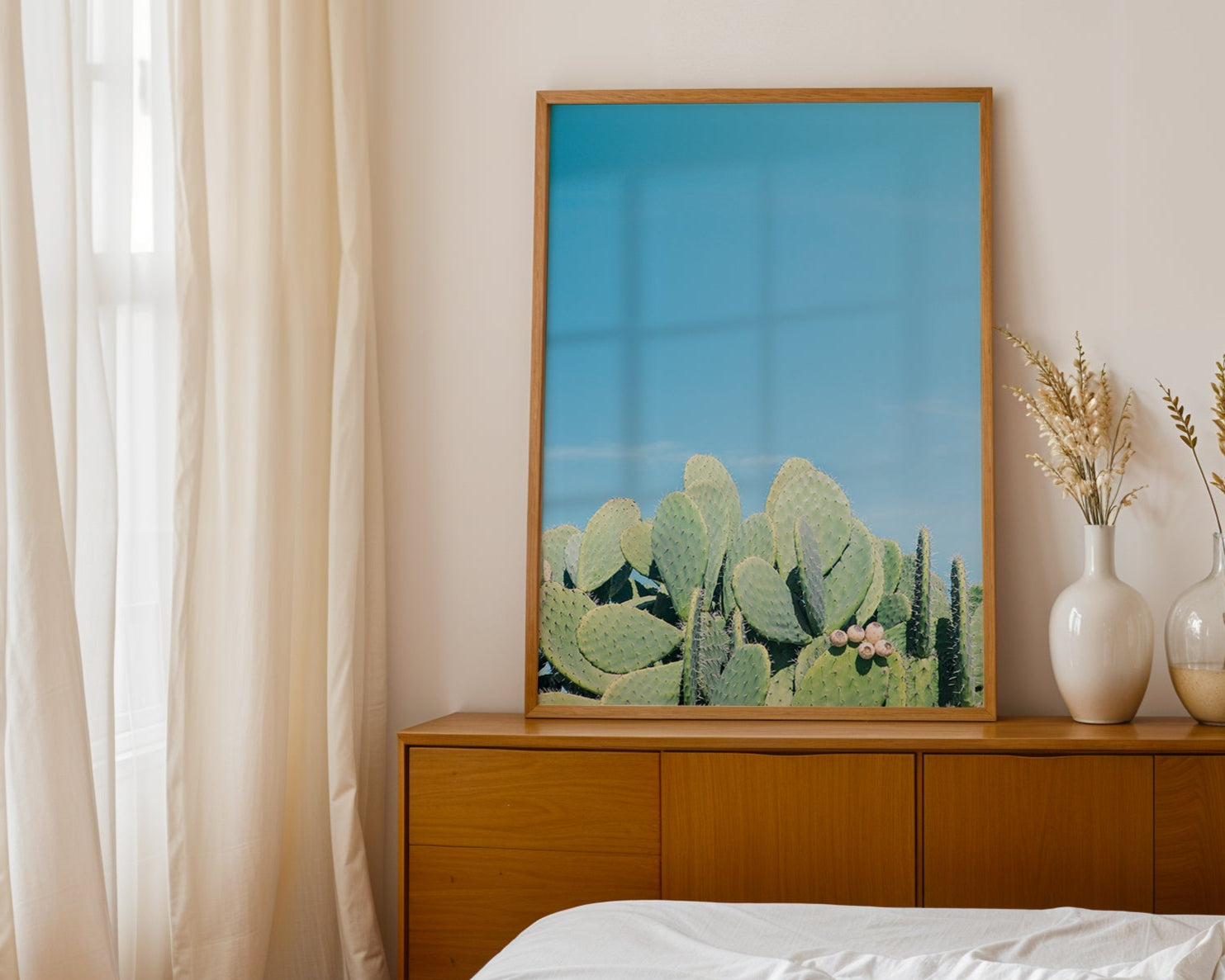DAYDREAM artwork featuring prickly pear cacti under a clear blue sky in a modern Southwest minimalist interior.