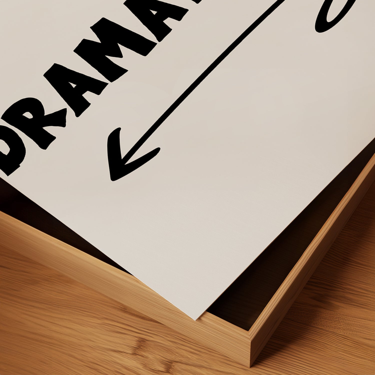 Close-up of DRAMATiC EXiT LEFT poster with bold typography and arrow on matte paper in wooden frame.