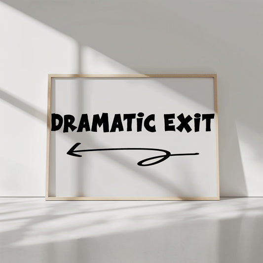 DRAMATiC EXiT LEFT poster with bold black typography and left-pointing arrow on matte white paper print.