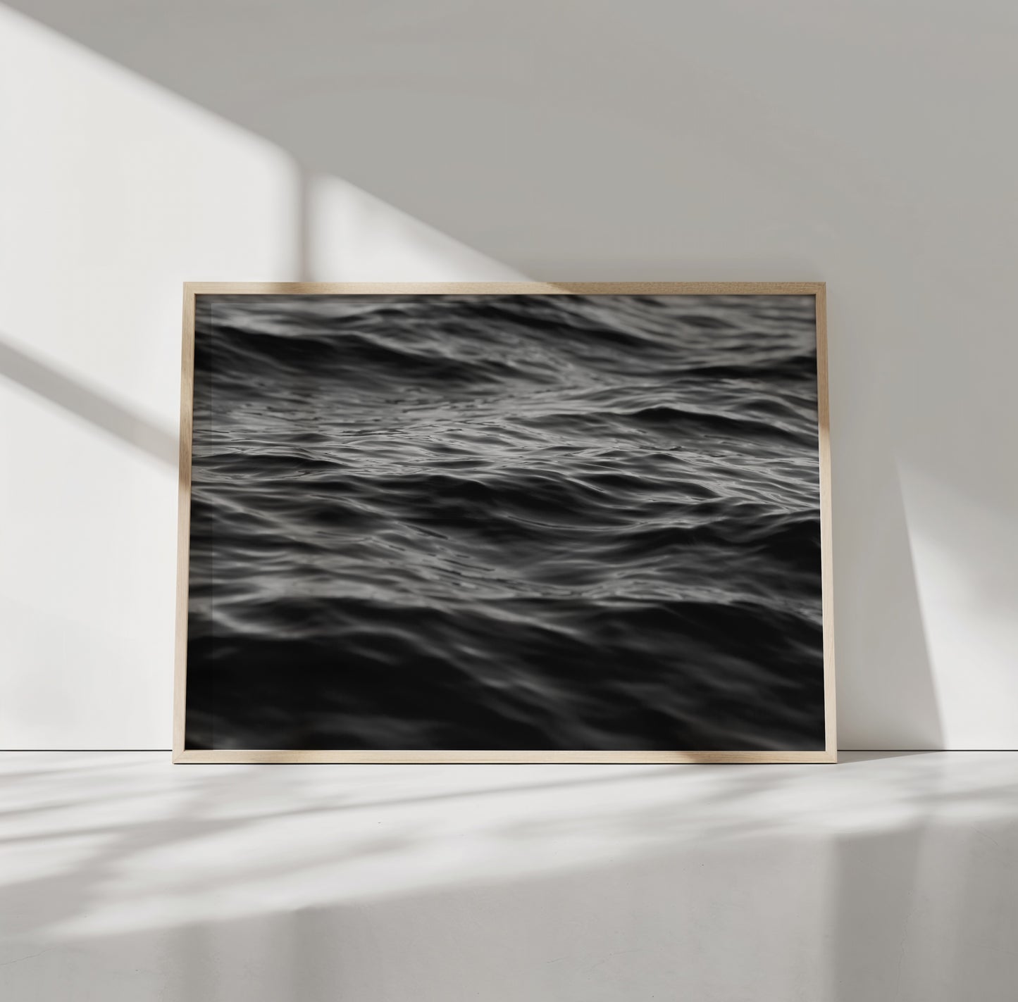 EAU NOiRE black-and-white photograph of textured ocean waves, a moody and hypnotic art piece for minimalist interiors.