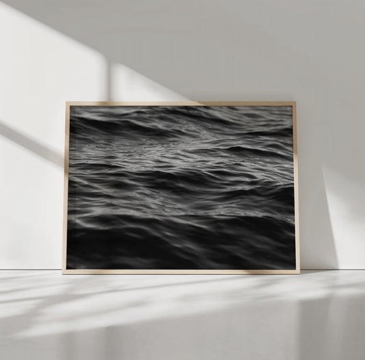 EAU NOiRE black-and-white photograph of textured ocean waves, a moody and hypnotic art piece for minimalist interiors.