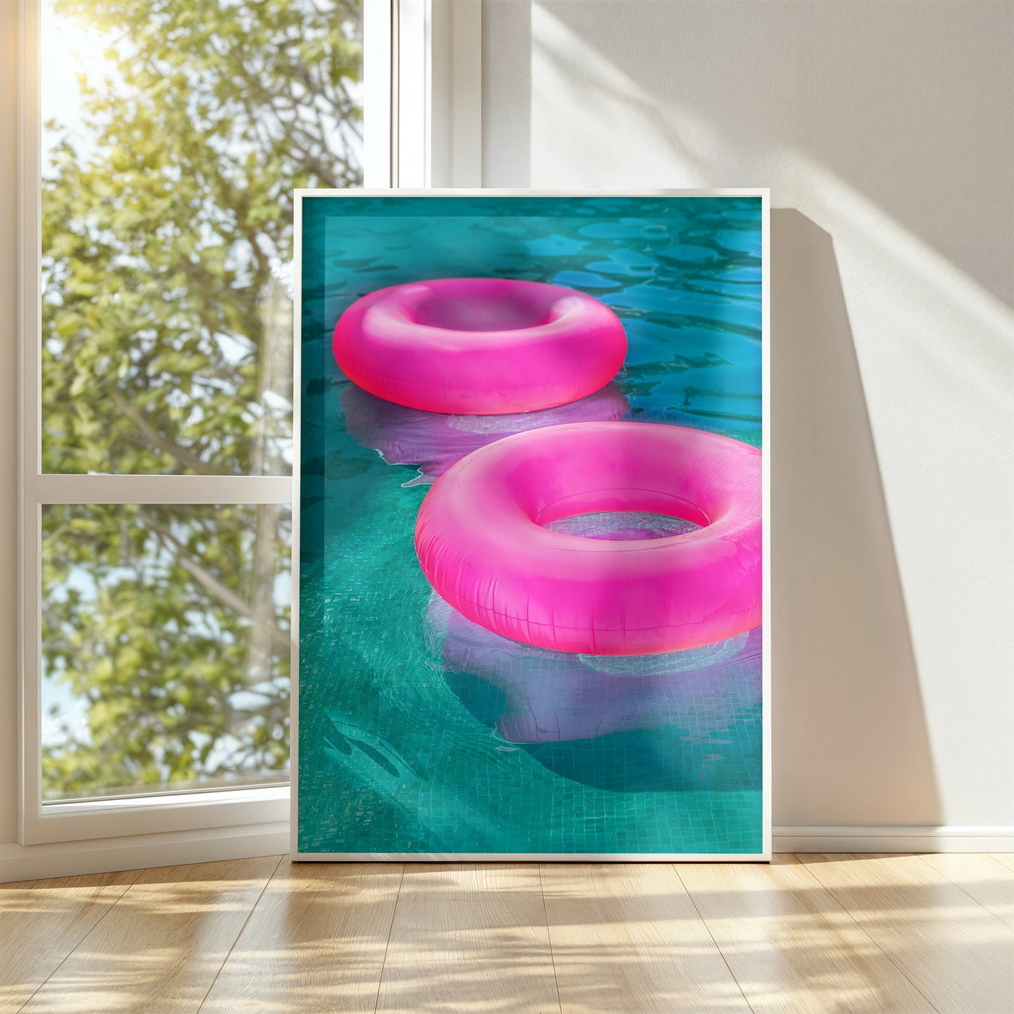 FLOATiES vibrant art print with bold hot pink pool floats on turquoise water in a sunlit room.