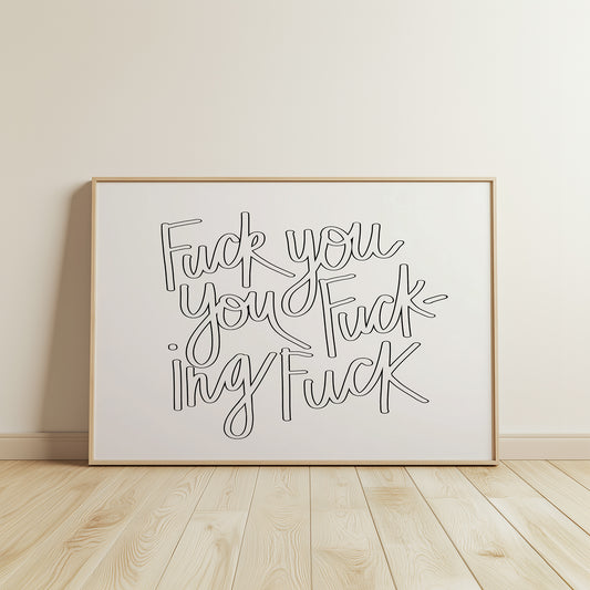 Framed black and white hand-lettered poster titled "FUCK YOU YOU FUCKING FUCK" displayed on wooden floor against white wall.