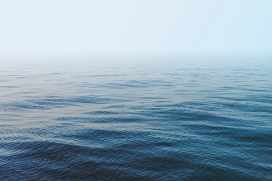 HER MAJESTY minimalist ocean print showing calm blue and turquoise waves with an endless horizon for serene interiors.