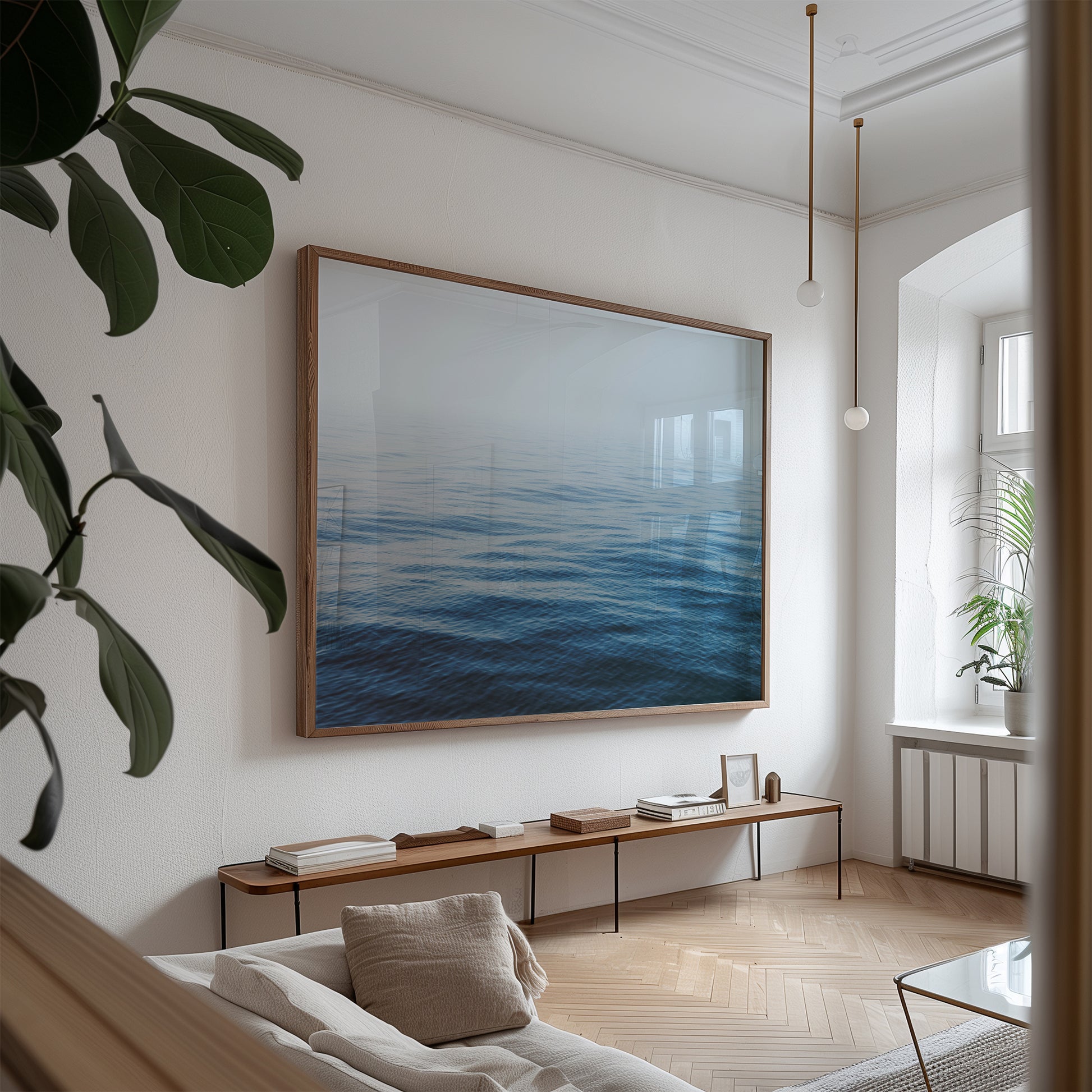 HER MAJESTY minimalist ocean print featuring calm blue water and horizon in a modern serene living room.
