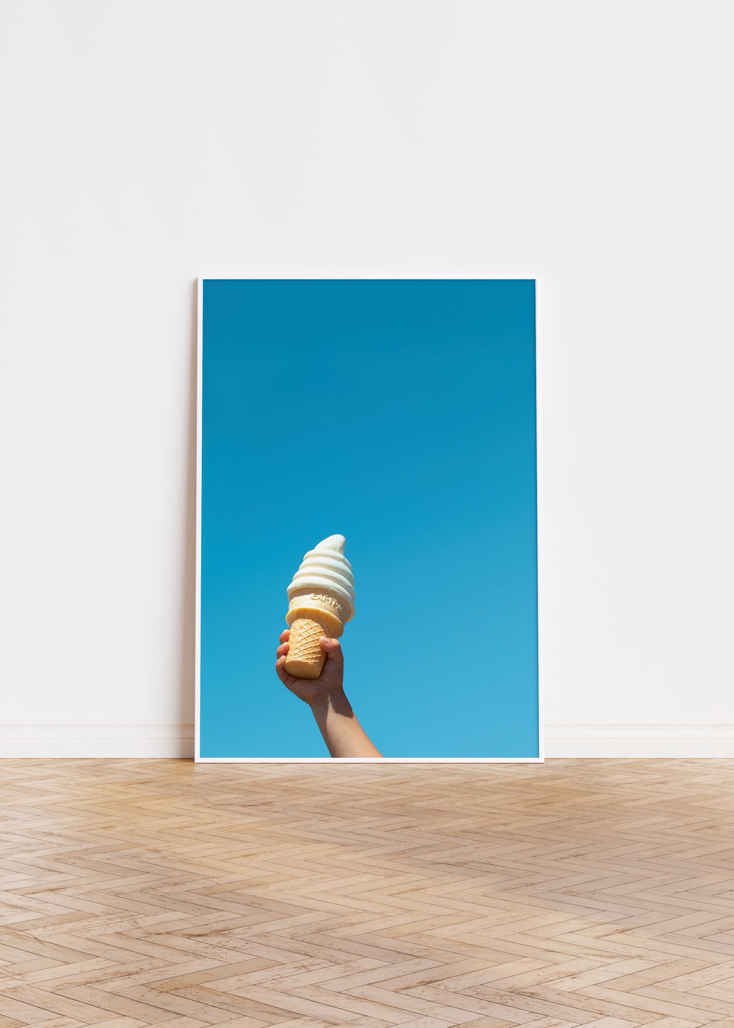IN FROSTiES WE TRUST print showing a child's hand holding soft-serve ice cream against a clear blue sky.