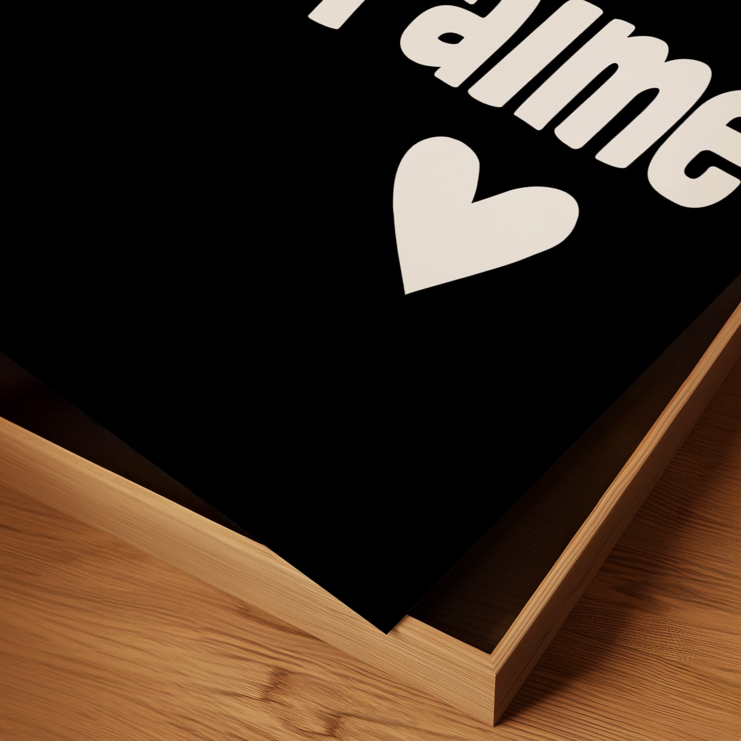 Close-up of the JE T'AiME black-and-white poster with playful typography and heart detail on matte paper.