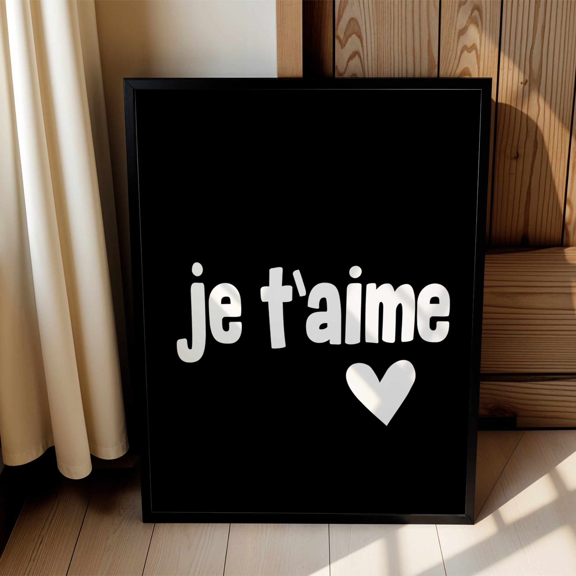 Black and white minimalist poster with "JE T'AiME" text and heart detail perfect for bedrooms or gifting.