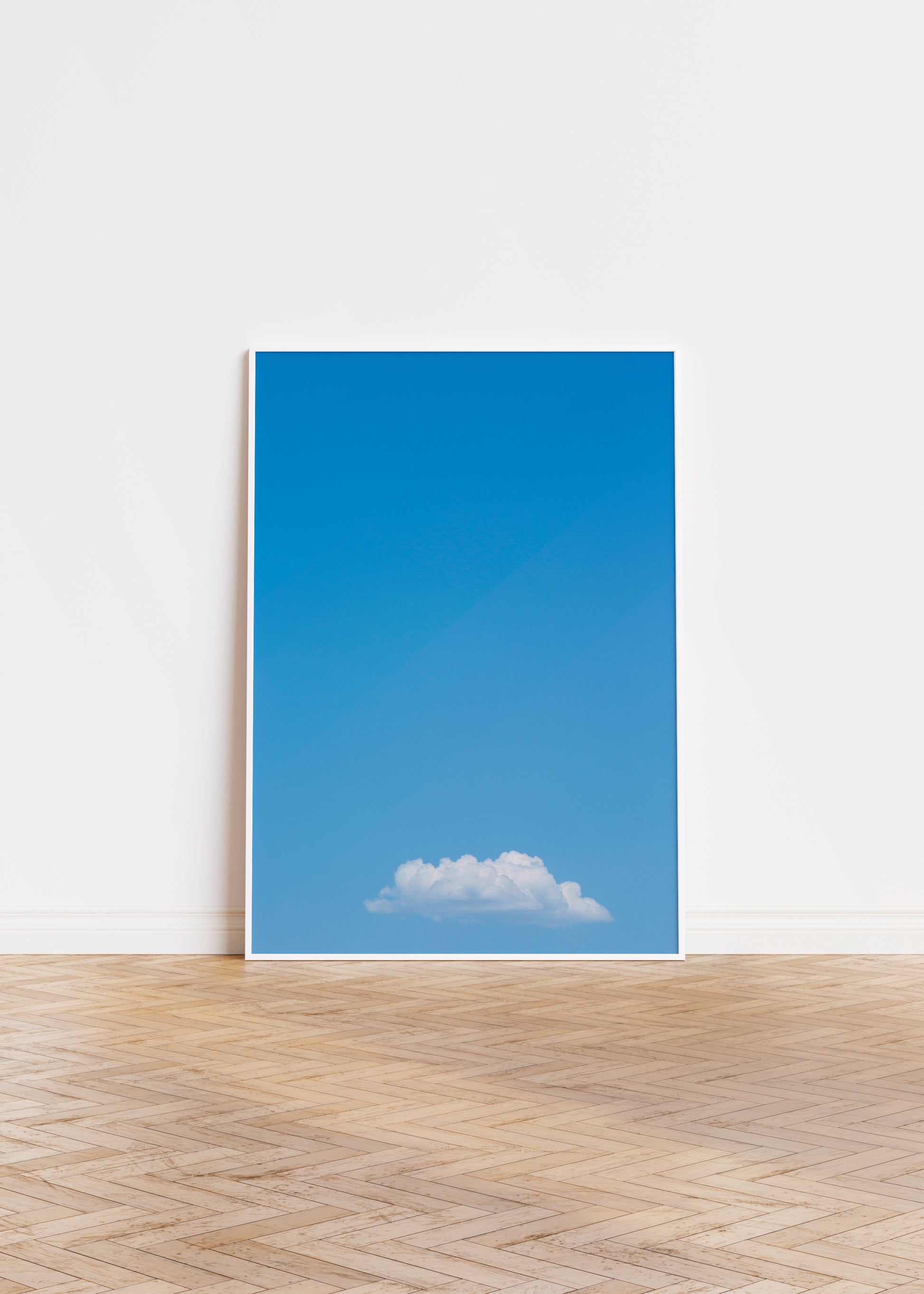 Minimalist photograph titled MEANWHiLE showing a single fluffy cloud in a vast blue sky, perfect for modern interiors.