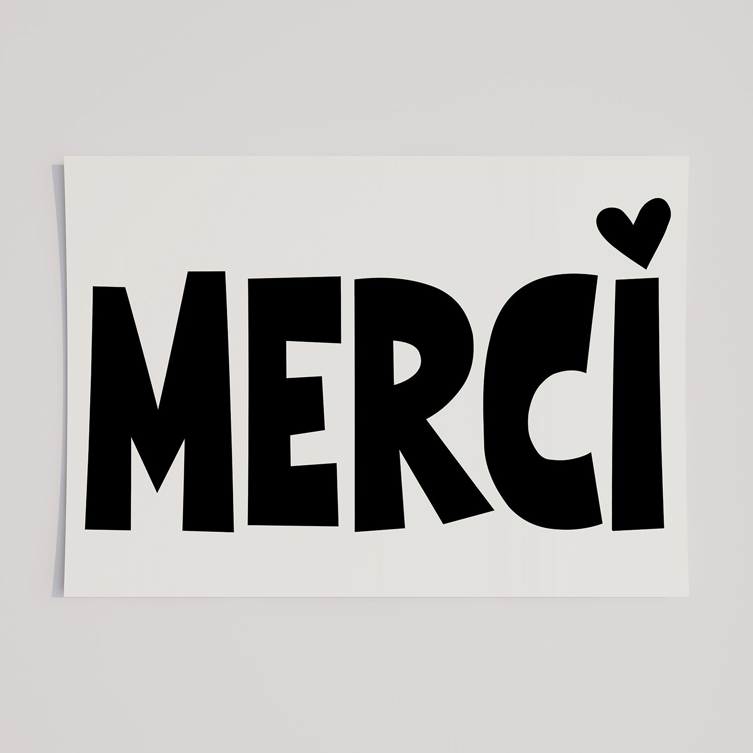 MERCi poster with bold black letters and a heart dotting the i, stylish gratitude artwork for home or office decor.