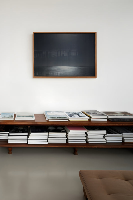 MiDNiGHT serene starry night sky over moonlit sea photograph in shades of black and grey framed on wall.