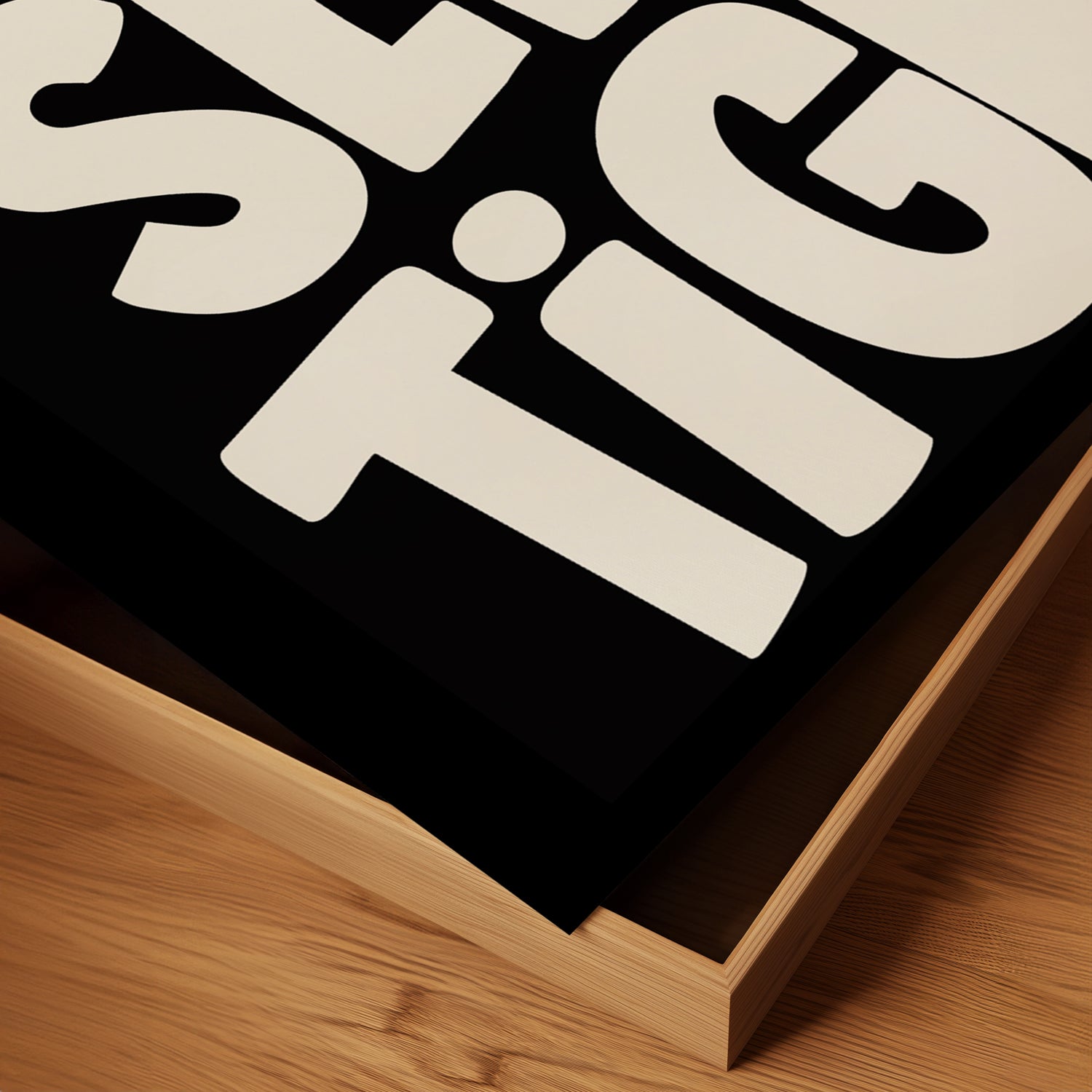 Close-up of the SLEEP TiGHT black and white typography poster corner resting on a wooden surface.