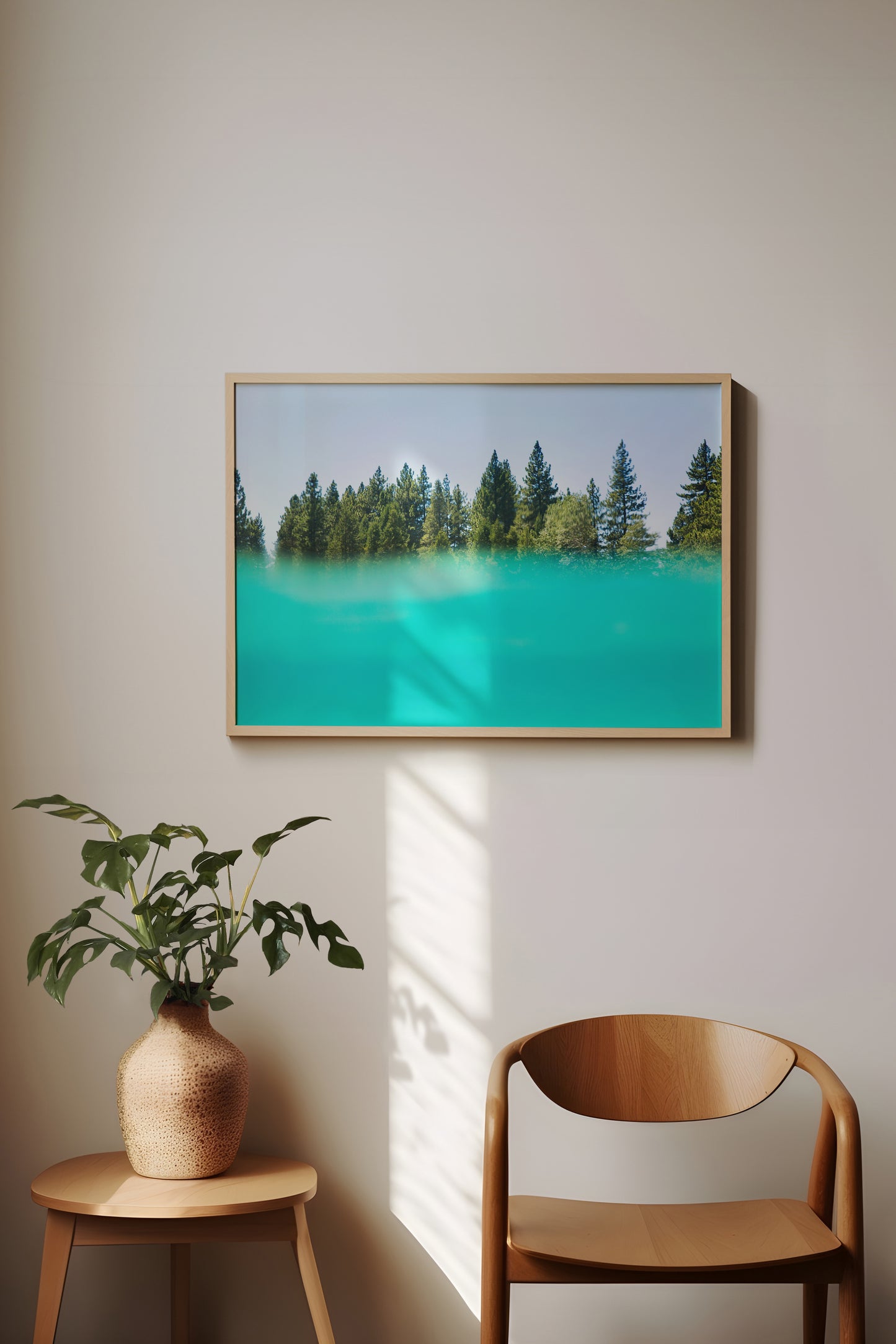 SUGAR PiNE split-view photo of turquoise water and pine forest, modern nature-inspired wall art for cabin decor.