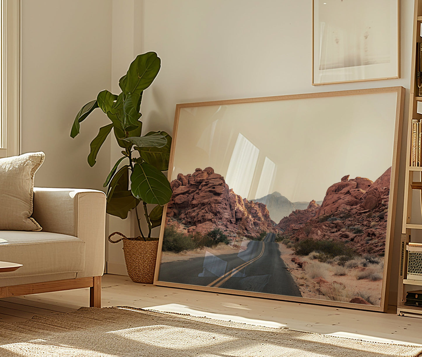 Framed art print of THE ROAD showing a desert highway winding through red rock formations in a modern living room.