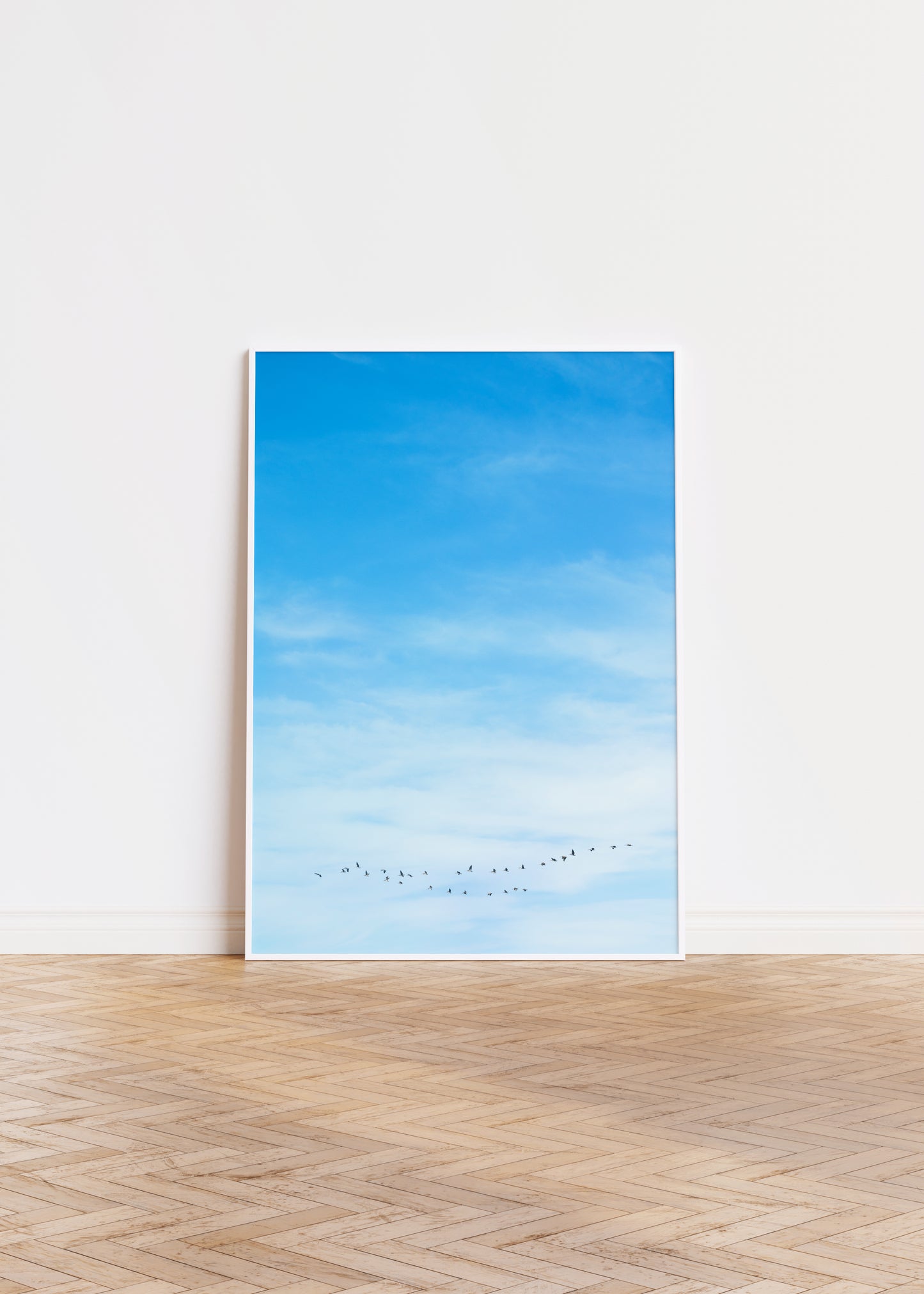 birds fly in formation against a bright blue sky minimalist modern wall art by denise crew