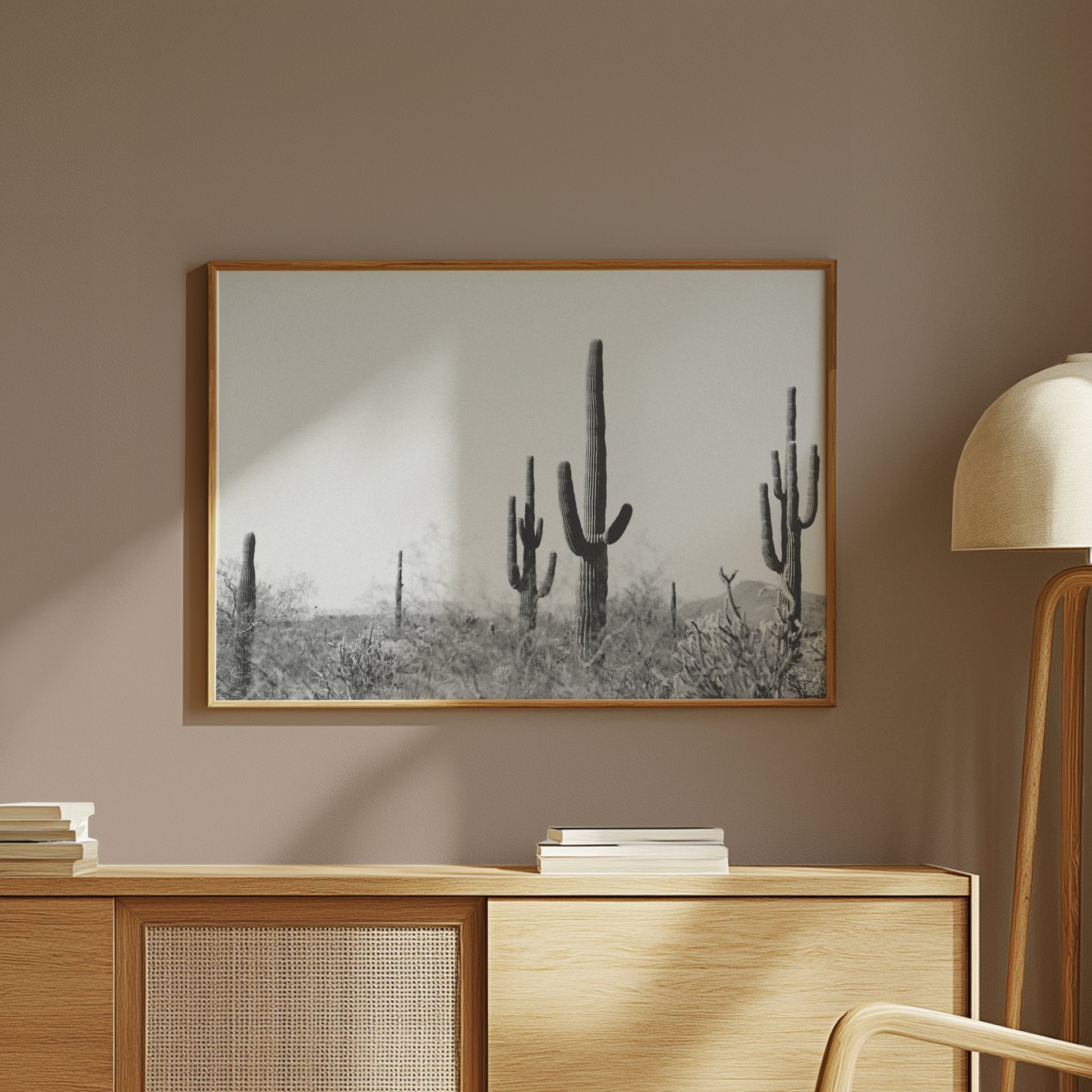 WiLD WiLD black and white saguaro cactus print in a modern minimalist home with warm wooden decor and soft lighting.