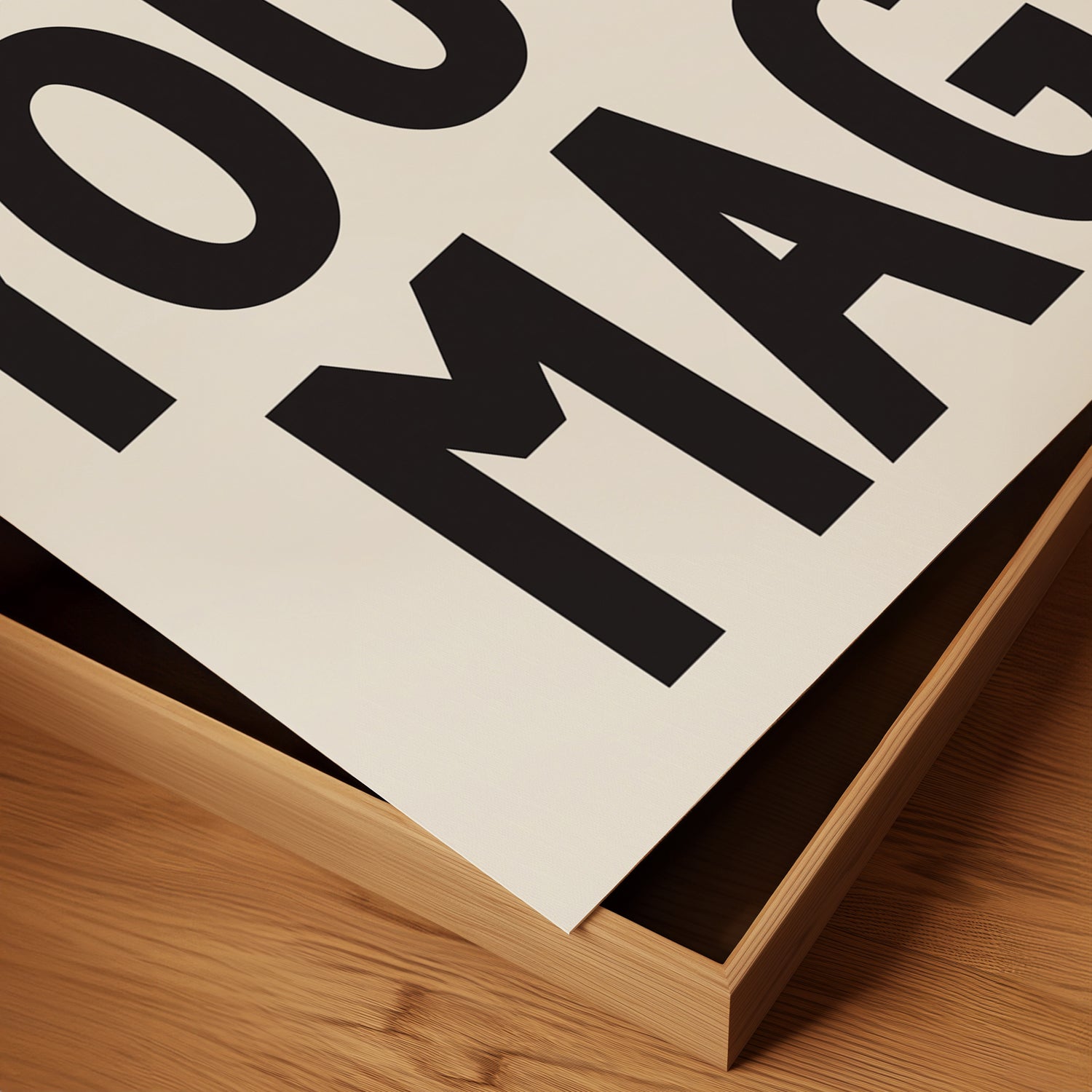 Close-up of "YOU ARE MAGiC" typographic poster printed on matte paper with bold black letters on white background.