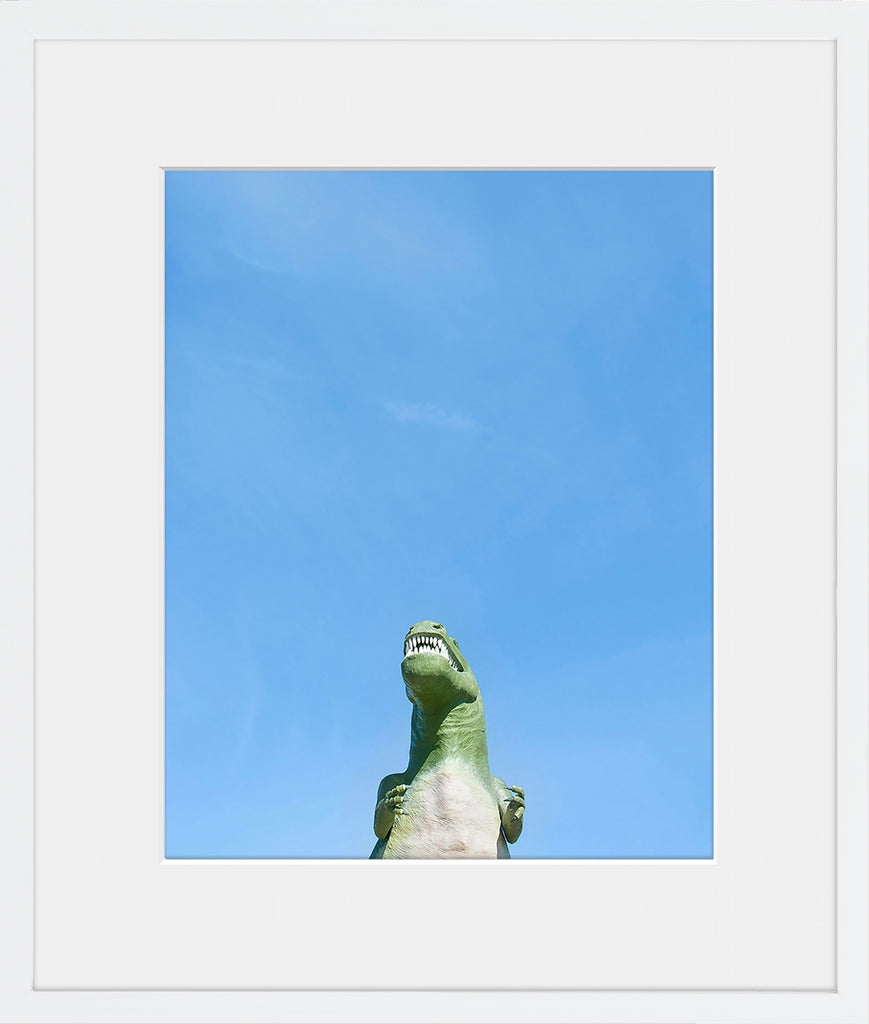 A minimal image of a dinosaur against a blue sky. Fun for a child's room or nursery.