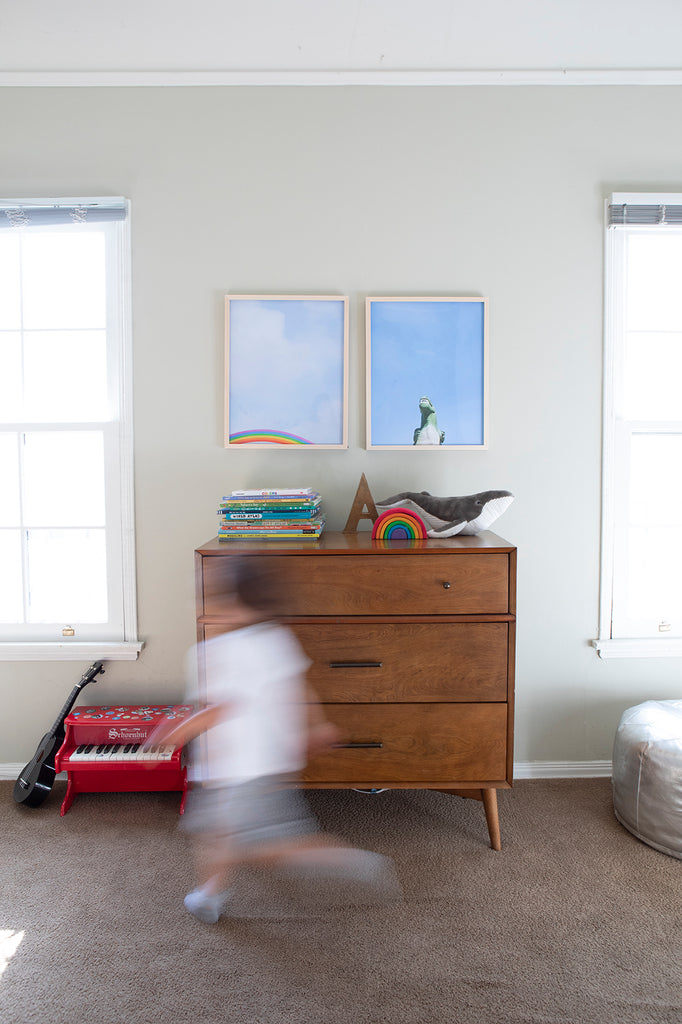 rainbow against a bright blue sky minimalist modern wall art by denise crew