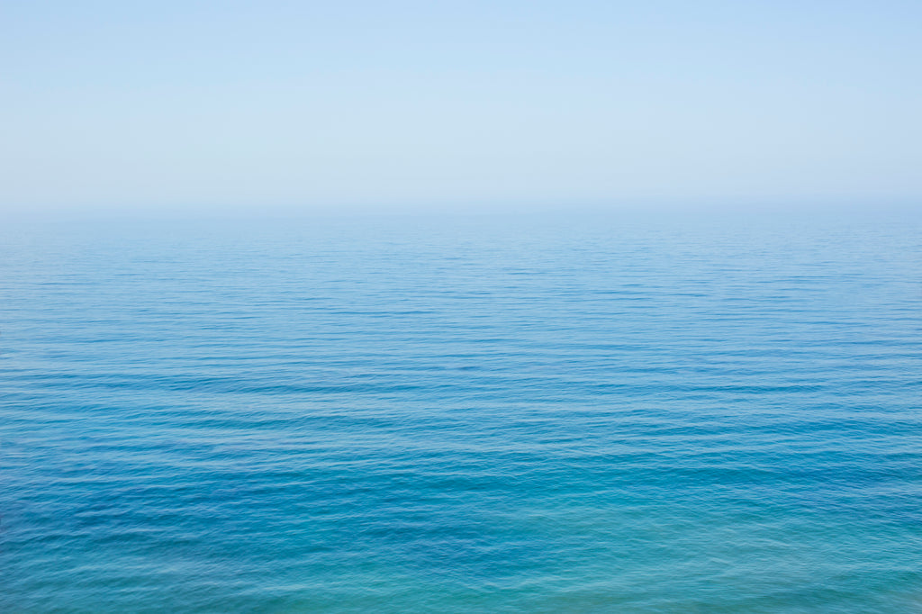 bright vast blue ocean minimalist modern wall art by denise crew