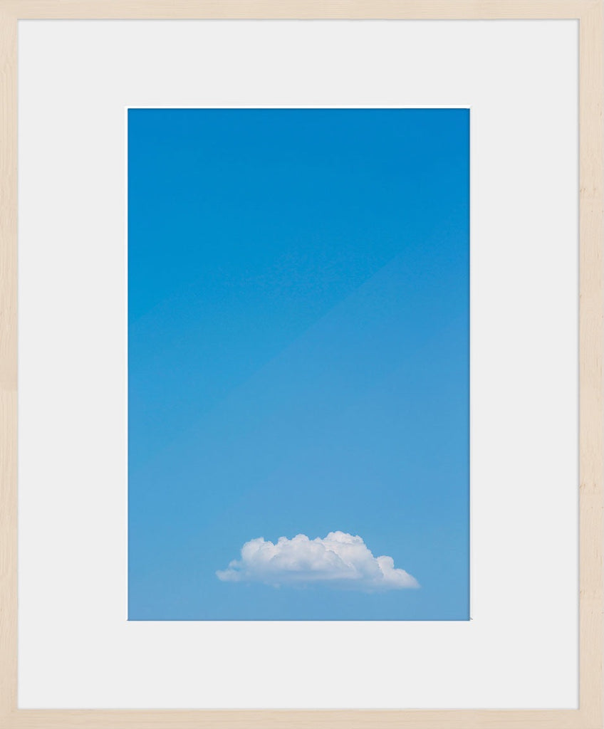 A single cloud amongst a bright blue sky. Available in square and vertical formats from sizes 5x5 up to 30x45. Printed on archival luster matte paper. - PRINTSHOP by Denise Crew