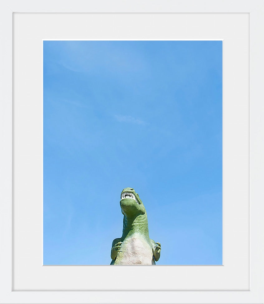 A minimal image of a dinosaur against a blue sky. Fun for a child's room or nursery.